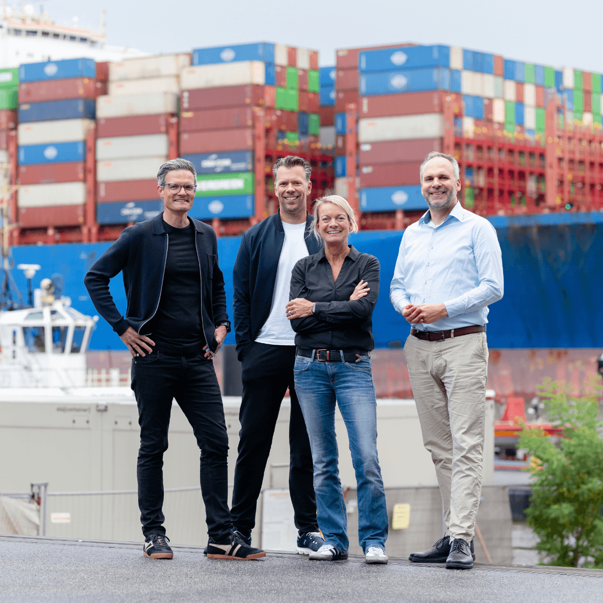 four people at a pier