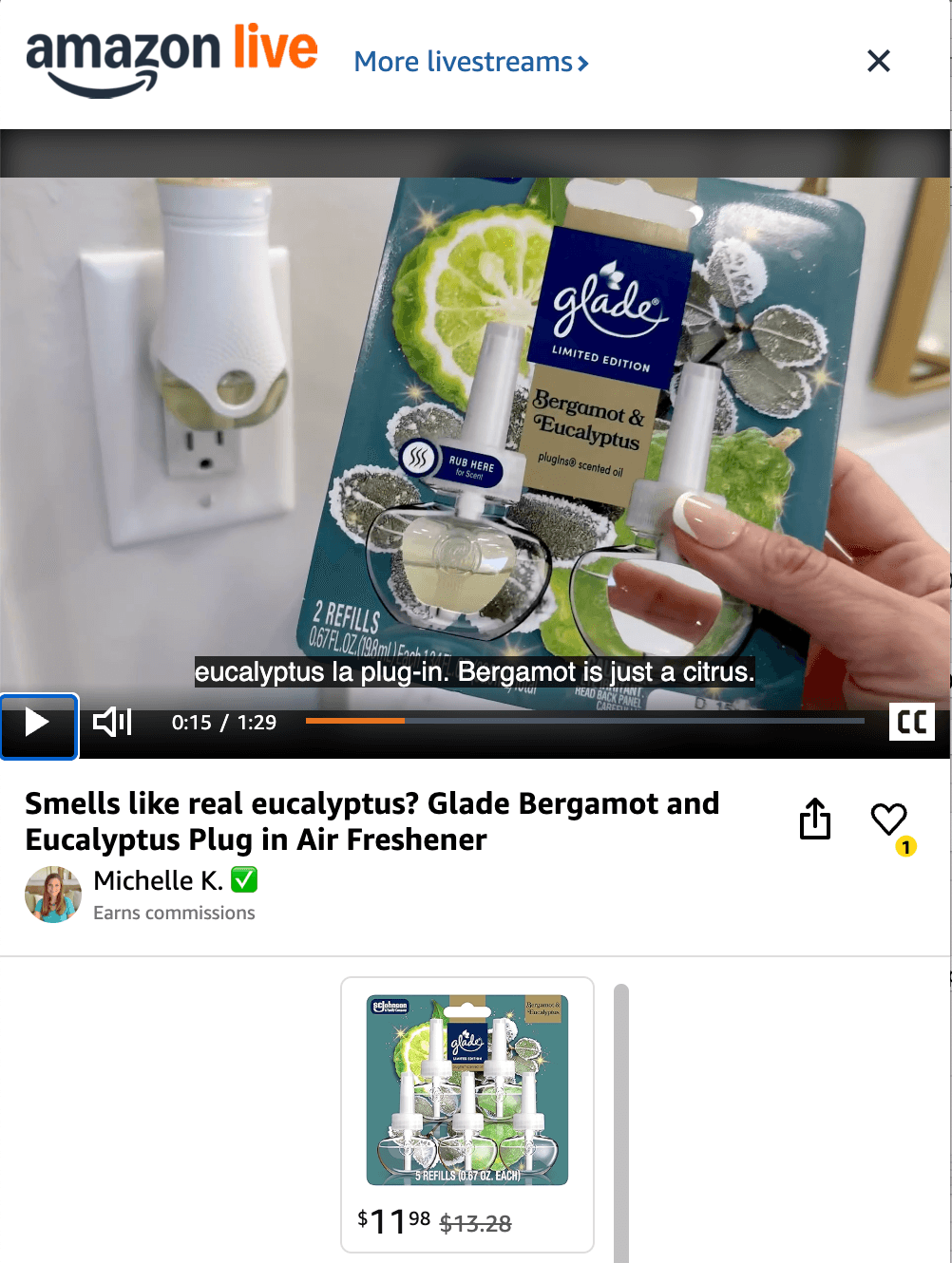 Person holding a Glade Bergamot and Eucalyptus plug-in air freshener package in front of a plugged-in diffuser.