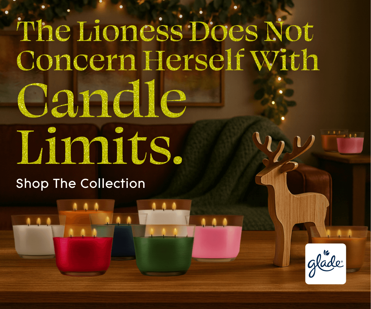 A cozy room with glowing candles in various colors on a wooden table, a wooden reindeer figure, and a festive, lit garland. Text: "The Lioness Does Not Concern Herself With Candle Limits."