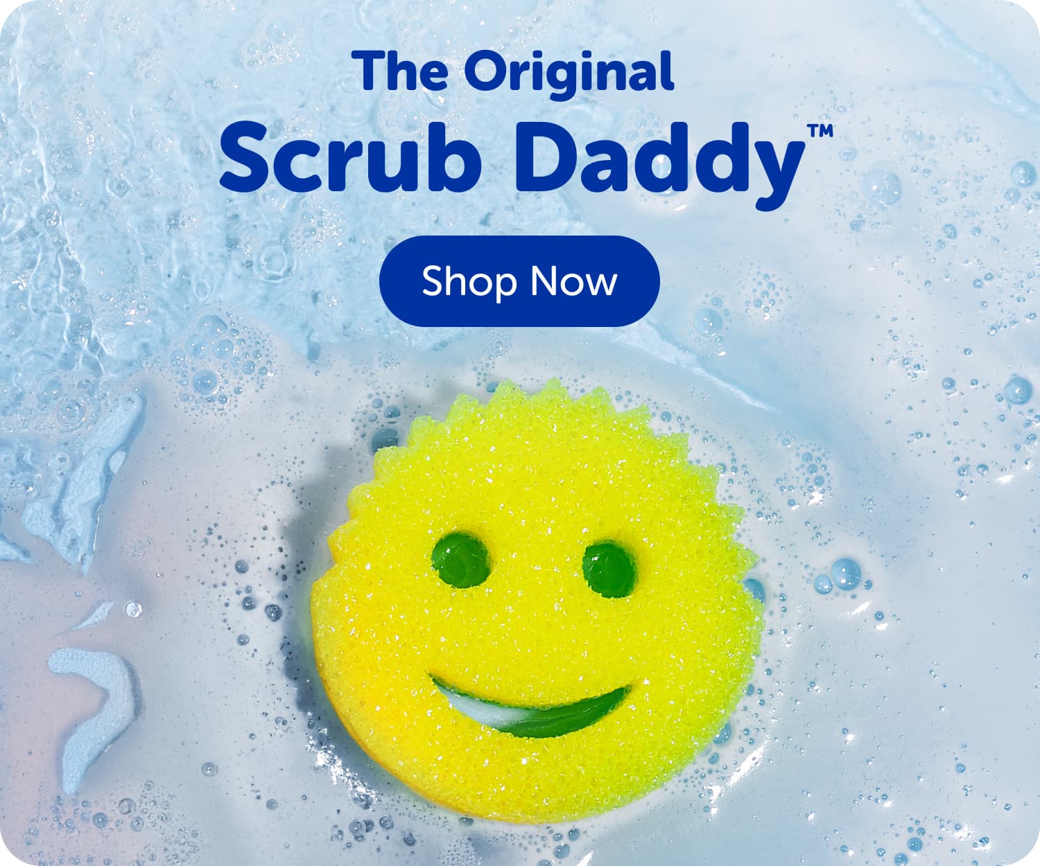 The original Scrub Daddy shown floating in water with soap all around, yellow smiley face