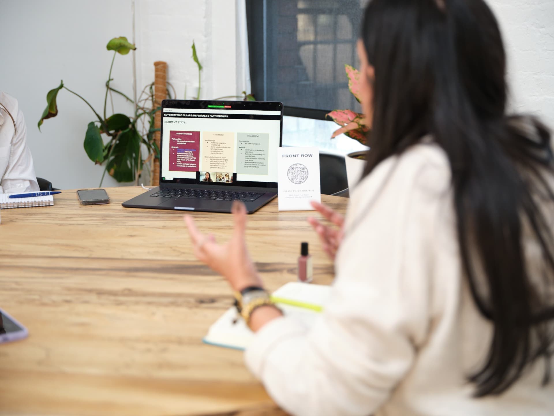 Woman expresses at a screen in an office