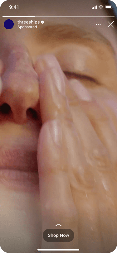 A person gently massages their moist face with hands, focusing on the nose area, in a skincare routine.